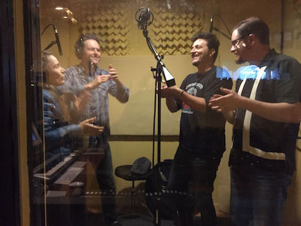claps in vocal booth
